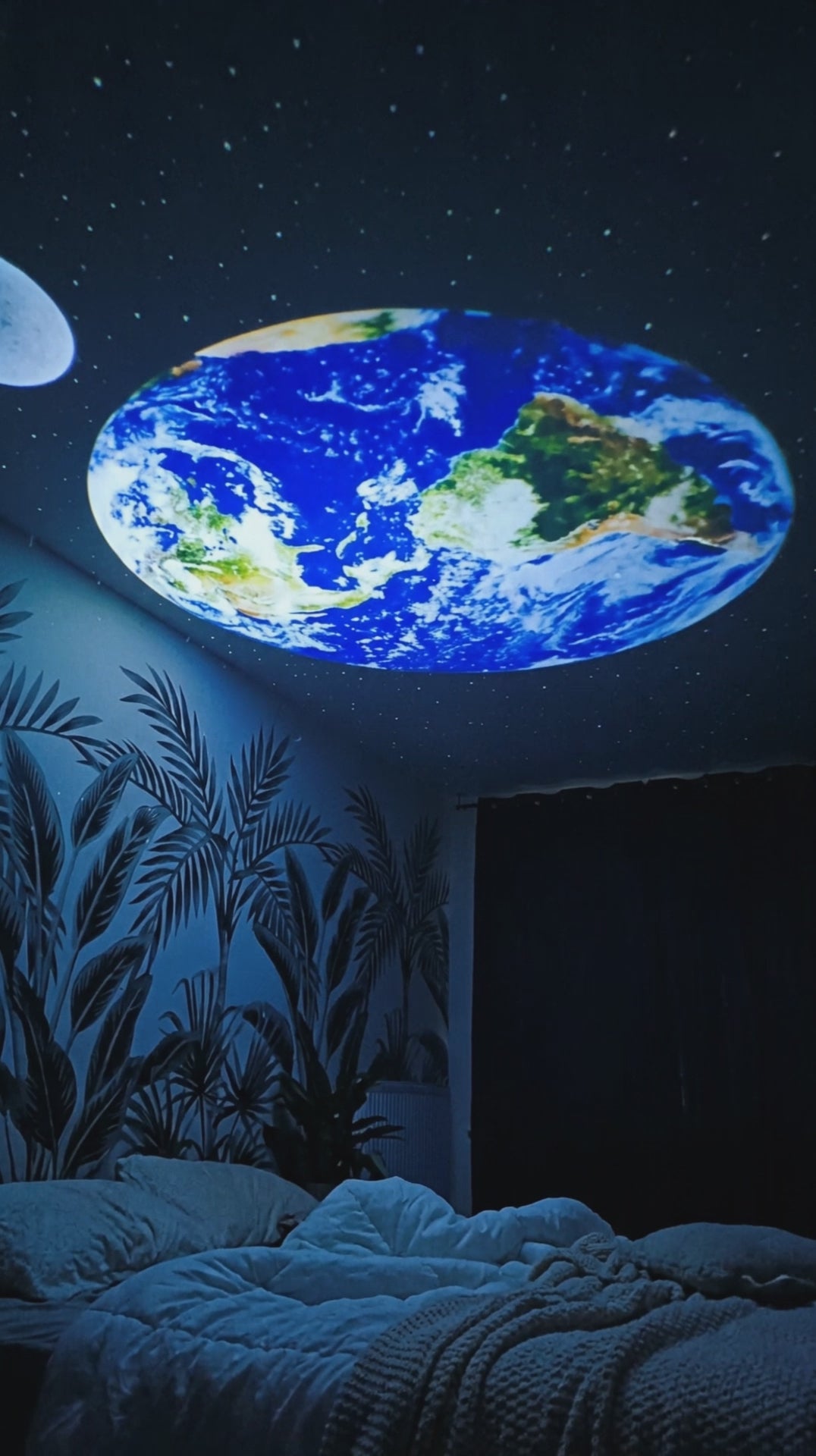 Earth projected on a bedroom ceiling